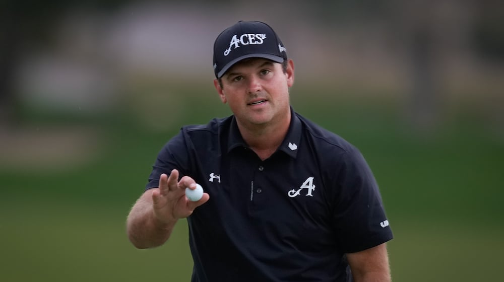 Patrick Reed of the United States reacts after winning the Dubai Desert Classic in United Arab Emirates, Sunday, Jan. 25, 2026. (AP Photo/Altaf Qadri)