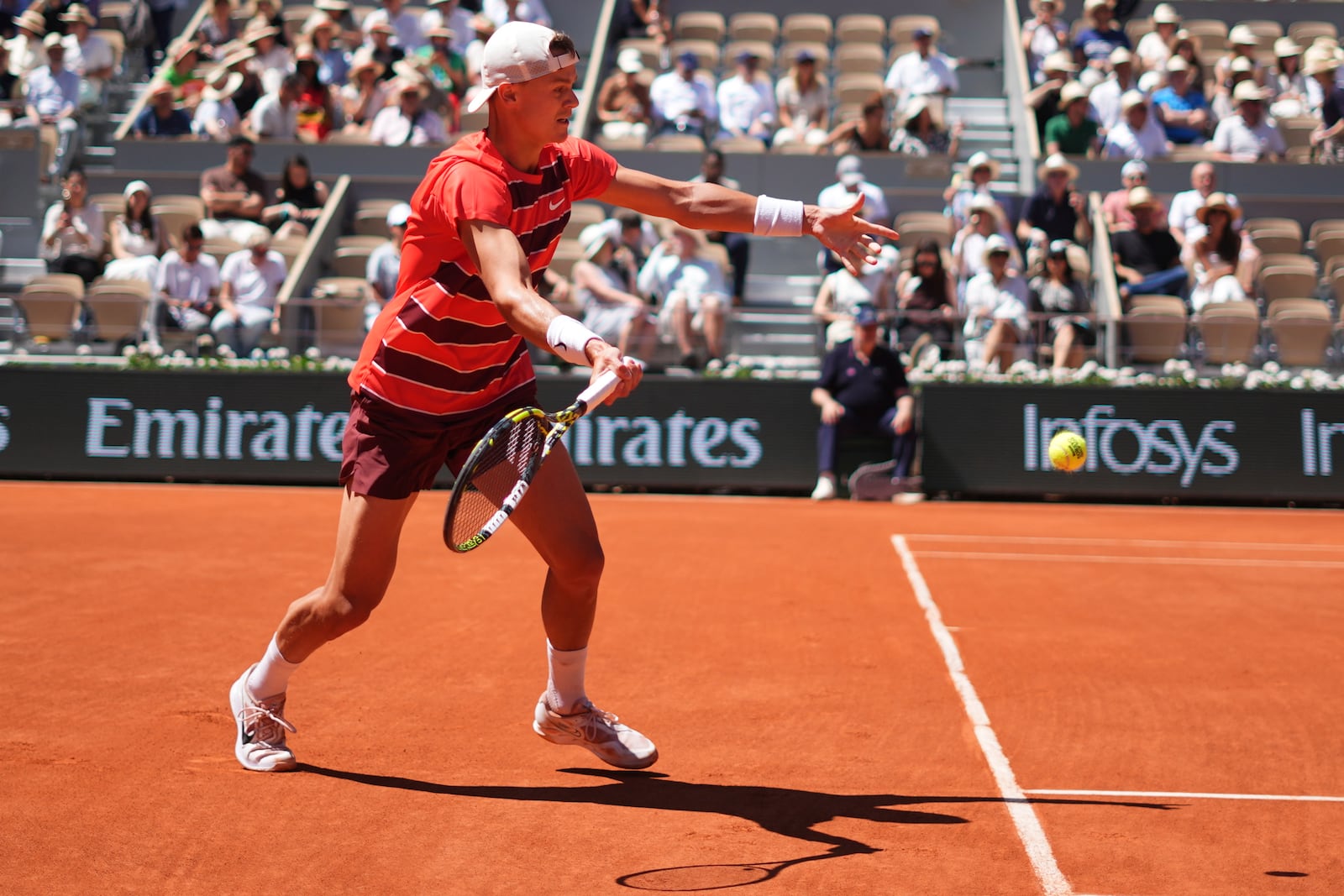 Denmark's Holger Rune returns the ball to France's Quentin Halys during their third round match of the French Tennis Open, at the Roland-Garros stadium, in Paris, Friday, May 30, 2025. (AP Photo/Lindsey Wasson)