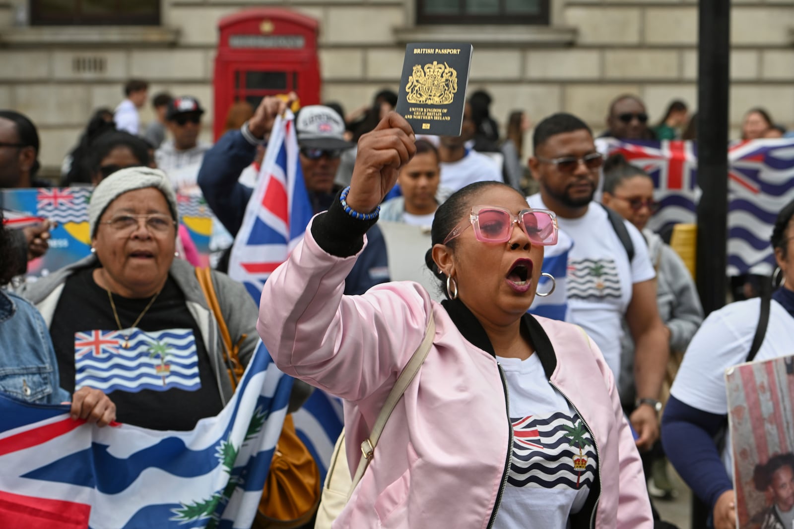 People demonstrate outside the Foreign Office in London, Thursday, May 22, 2025, after a British court blocked the U.K. from transferring sovereignty over the Chagos Islands to Mauritius hours before the agreement was due to be signed. (AP Photo/Thomas Krych)