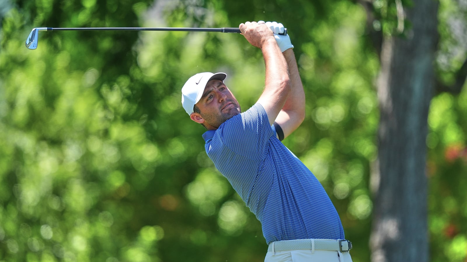 Scottie Scheffler watches his tee shot on the sixth hole during the final round of the CJ Cup Byron Nelson golf tournament in McKinney, Texas, Sunday, May 4, 2025. (AP Photo/LM Otero)