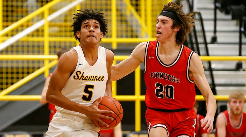 Shawnee High School junior Zion Crowe is guarded by Jonathan Alder senior Joey Walker during a game earlier this season. CONTRIBUTED PHOTO BY MICHAEL COOPER