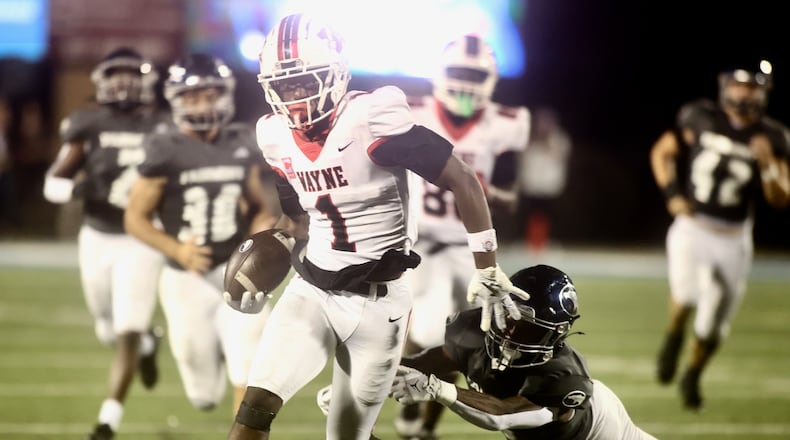 Wayne's Jamier Averette-Brown returns a kickoff against Fairmont on Friday, Sept. 19, 2025, at Roush Stadium in Kettering. David Jablonski/Staff