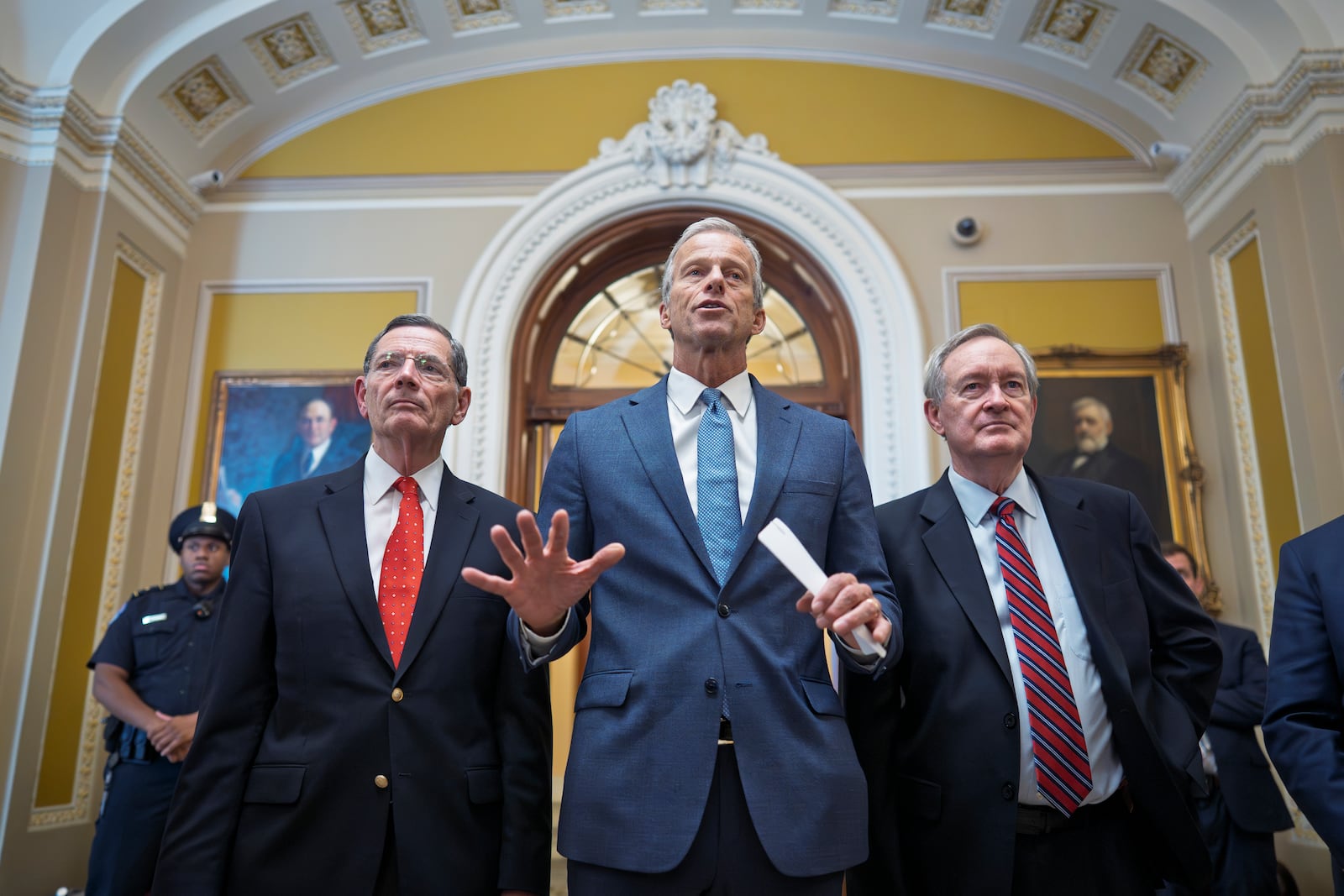 Senate Majority Leader John Thune, R-S.D., is flanked by Sen. John Barrasso, R-Wyo., the GOP whip, left, and Finance Committee Chairman Mike Crapo, R-Idaho, speaks to reporters after passage of the budget reconciliation package of President Donald Trump's signature bill of big tax breaks and spending cuts, at the Capitol in Washington, Tuesday, July 1, 2025. (AP Photo/J. Scott Applewhite)