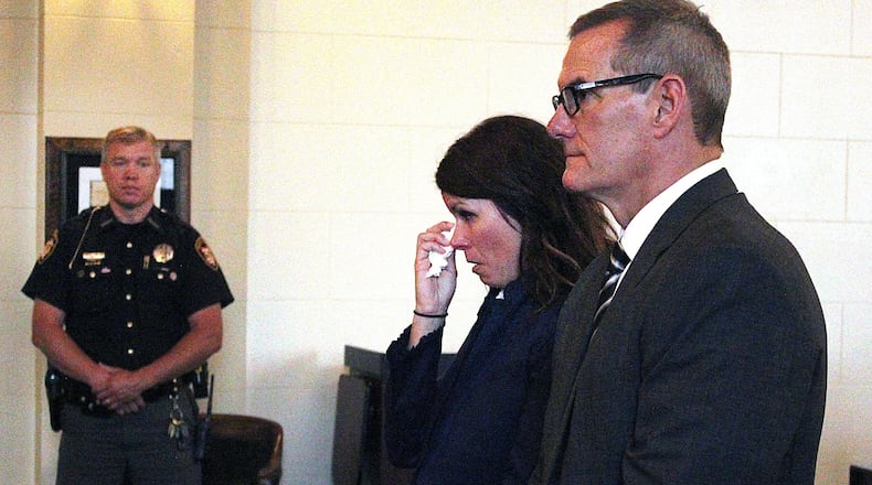 Kristine Baggs stand with her attorney, Richard Mayhall, in Clark County Common Pleas Court Tuesday morning. JEFF GUERINI/STAFF