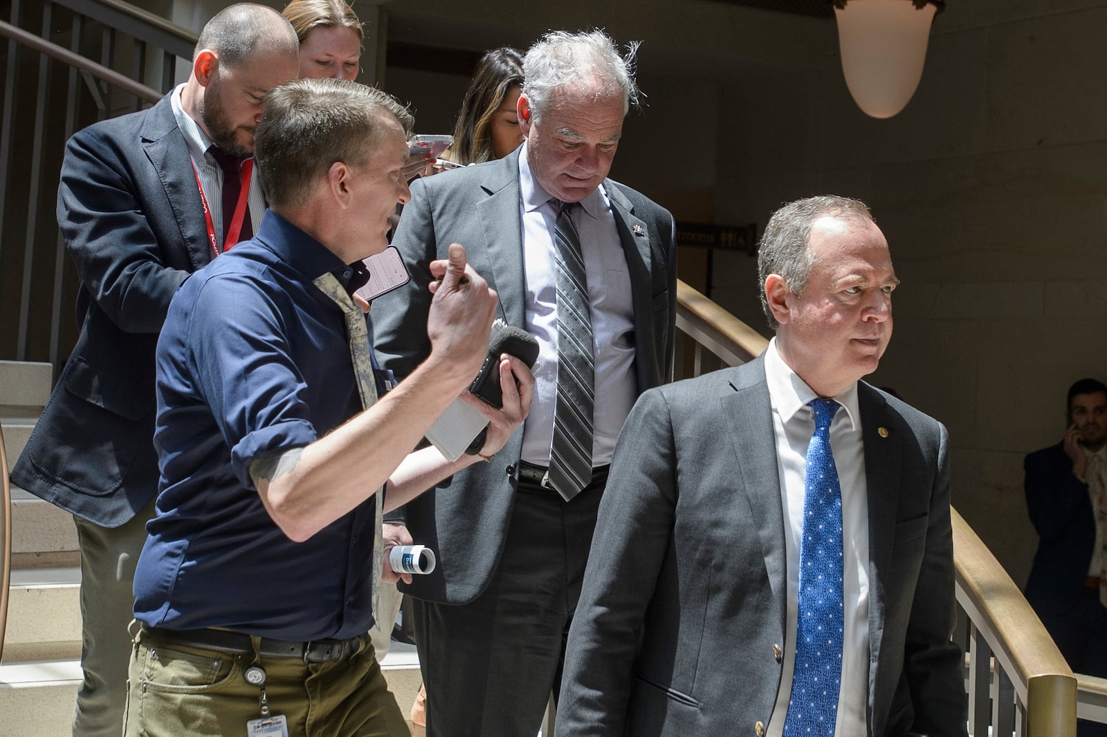 Sen. Tim Kaine, D-Va., center, and Sen. Adam Schiff, D-Calif., right, arrive for a classified briefing on President Donald Trump's directed strikes on Iranian nuclear facilities last weekend, at the Capitol in Washington, Thursday, June 26, 2025. (AP Photo/Rod Lamkey, Jr.)
