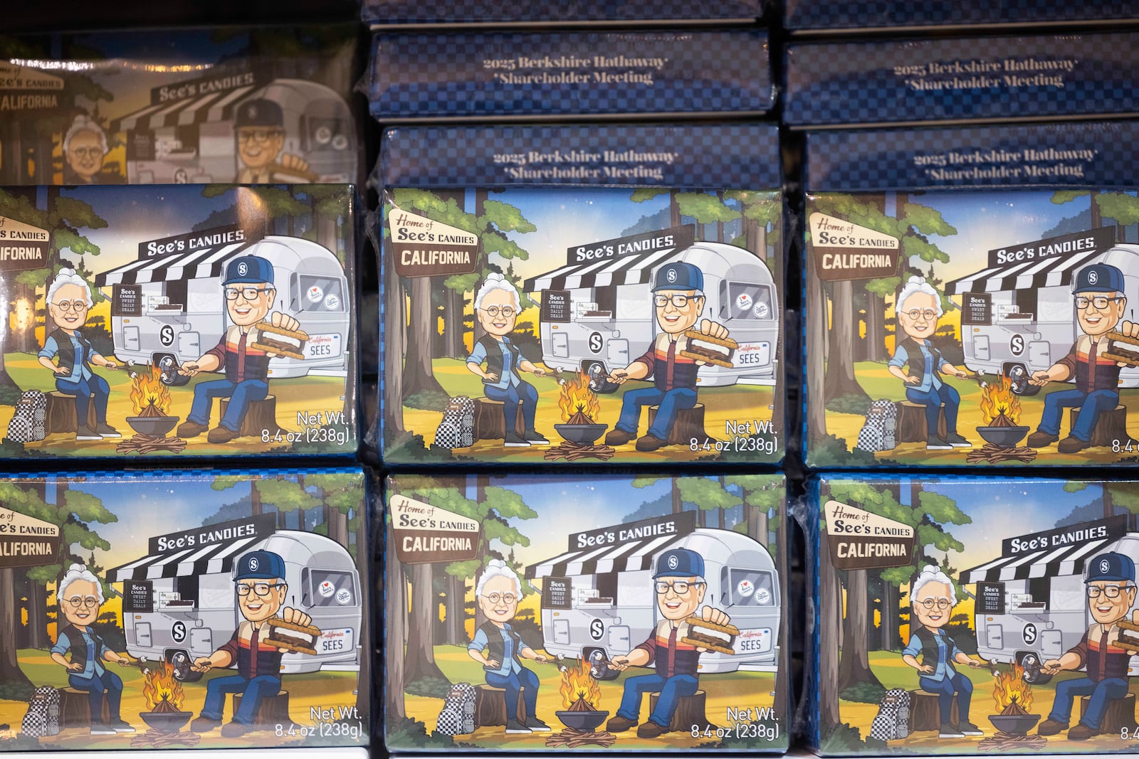 Boxes of See's Candies featuring an image of Warren Buffett at a campsite with See's Candies' namesake Mrs. See in CHI Health Center Omaha for the Berkshire Hathaway annual meeting Saturday, May 3, 2025, in Omaha, Neb. (AP Photo/Rebecca S. Gratz)
