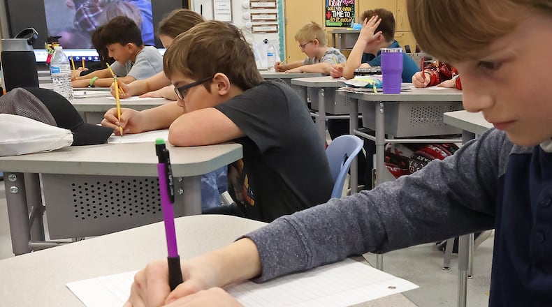 Fourth grade students at Greenon Elementary School working in class. BILL LACKEY/STAFF