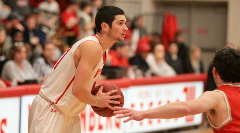 Wittenberg’s Jake Bertemes looks to make a pass during a game against Denison on Feb. 5, 2020, at Pam Evans Smith Arena in Springfield. David Jablonski/Staff