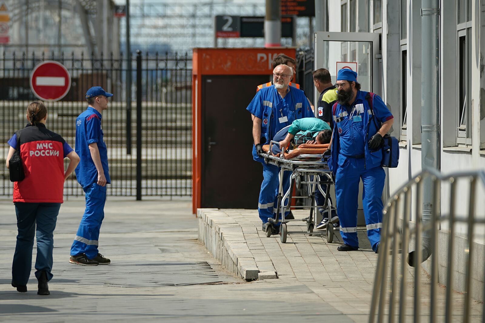 Emergency medics transport a wounded passenger at the railway station in Moscow, Russia, Sunday, June 1, 2025, after a road bridge collapsed on top of a passenger train in the Bryansk region, located on Russia's border with Ukraine. (AP Photo)