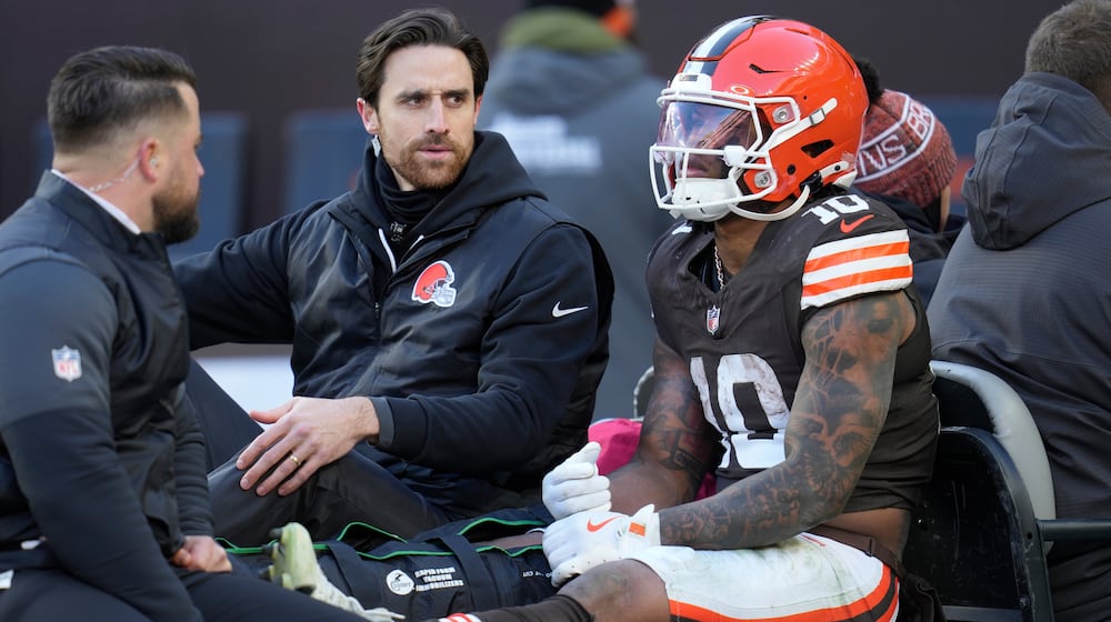Cleveland Browns running back Quinshon Judkins (10) is carted off the field with an injury against the Buffalo Bills during the first half of an NFL football game in Cleveland, Sunday, Dec. 21, 2025. (AP Photo/Sue Ogrocki)