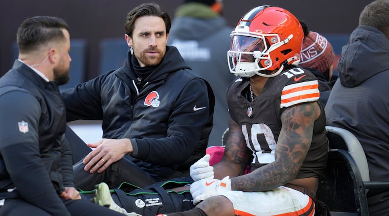 Cleveland Browns running back Quinshon Judkins (10) is carted off the field with an injury against the Buffalo Bills during the first half of an NFL football game in Cleveland, Sunday, Dec. 21, 2025. (AP Photo/Sue Ogrocki)