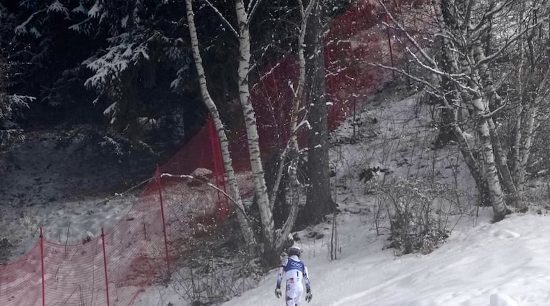 Norway's Atle Lie McGrath walks off the course after skiing out during an alpine ski, men's slalom race, at the 2026 Winter Olympics, in Bormio, Italy, Monday, Feb. 16, 2026. (AP Photo/John Locher)