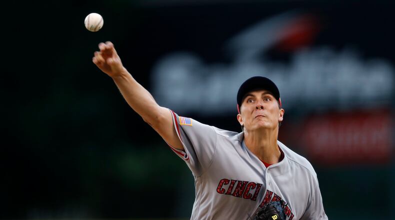 Cincinnati Reds starting pitcher Homer Bailey delivers a pitch to Colorado Rockies’ Raimel Tapia in the first inning of a baseball game Tuesday, July 4, 2017, in Denver. (AP Photo/David Zalubowski)