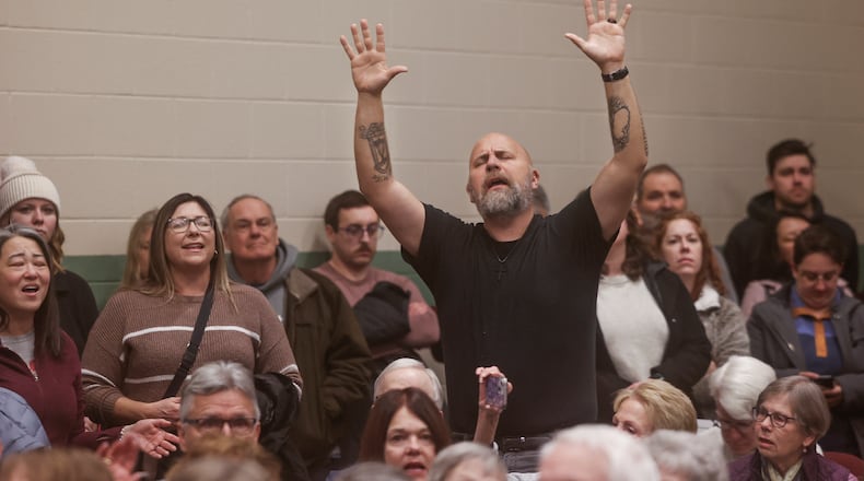 Audience members sing along to praise songs during Here We Stand: Faith Leaders for Immigration Justice & Family Unity at St. John Missionary Baptist Church on Monday, Feb. 2, 2026, in Springfield. Pastors, faith leaders and community members gathered to pray and call for the extension of Temporary Protected Status which is scheduled to expire on Tuesday, Feb. 3, 2026. JOSEPH COOKE/STAFF