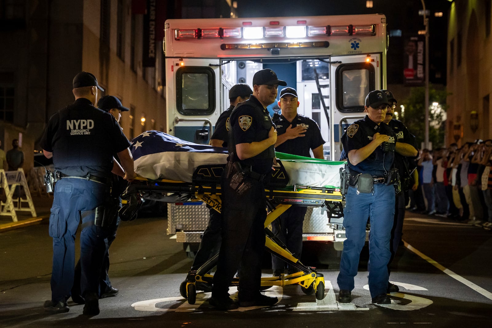 NYPD officers bring out the body of Didarul Islam, who was shot and killed by a gunman earlier this evening, out of NewYork-Presbyterian/Weill Cornell Medical Hospital, early Tuesday, July 29, 2025, in New York. (AP Photo/Angelina Katsanis)