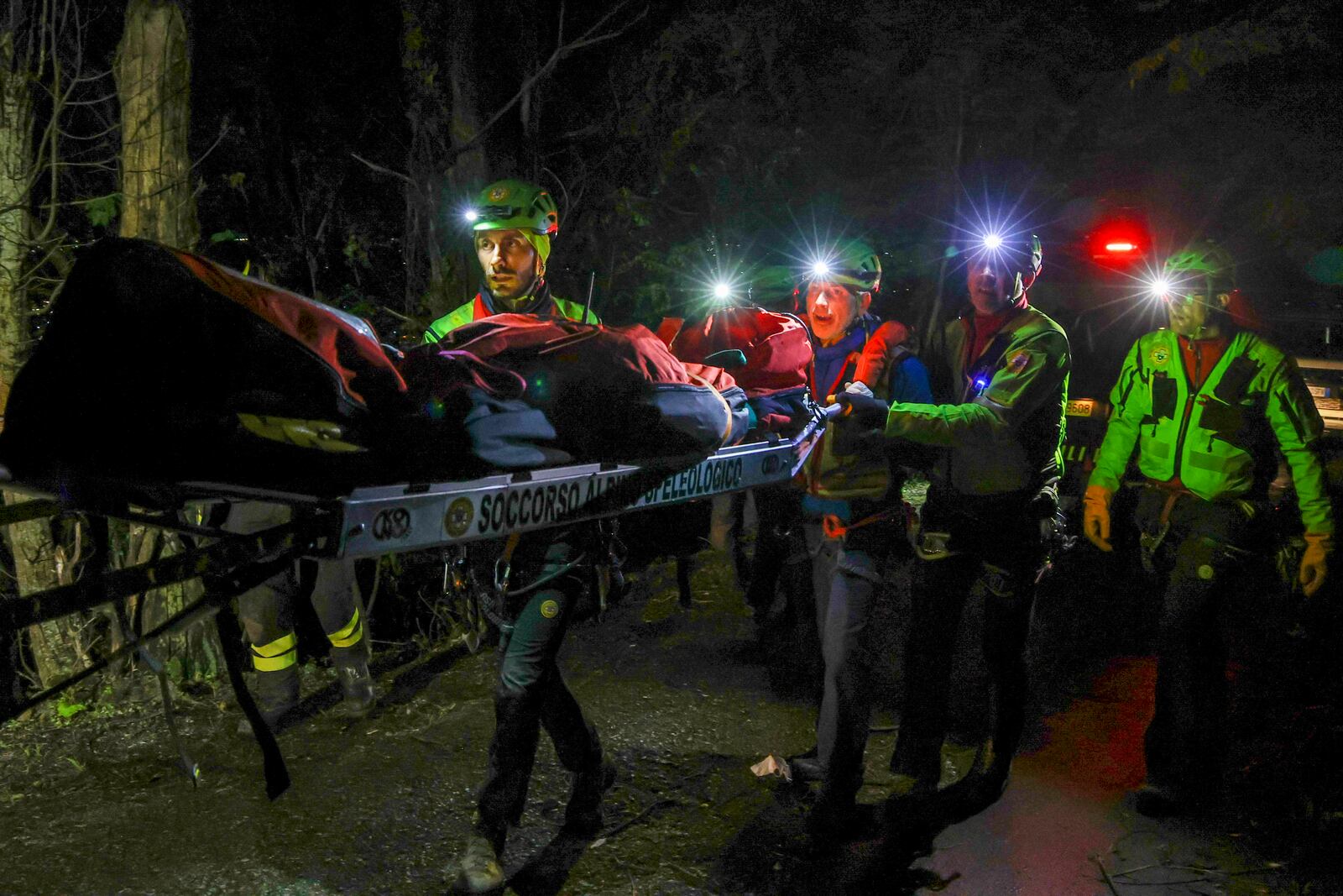 Rescuers recoup the body of one of the victims of a cable car carrying tourists south of Naples which crashed after the cable snapped, killing at least four people and injuring one in Castellamare di Stabia, near Naples, Italy, Thursday, April 17, 2025. (AP Photo/Salvatore Laporta)