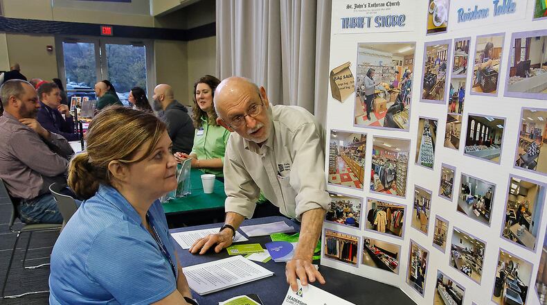 Grover Butler, from St. John's Lutheran Church, talks to Jodi Lucas, from Leadership Clark County, about some of the services they offer Thursday, April 11, 2024 during the Leadership Clark County Non-Profit Fair at the Hollenbeck Bayley Conference Center. BILL LACKEY/STAFF