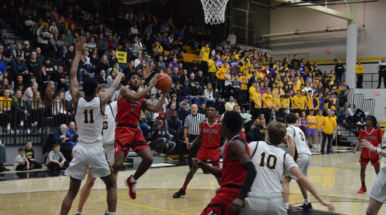 Trotwood-Madison’s Sammy Anderson puts up a shot during Friday night’s game at Centerville. The Rams won 63-59 to improve to 15-2. Eric Frantz/CONTRIBUTED