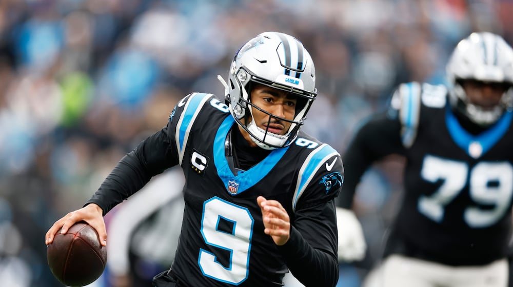 Carolina Panthers quarterback Bryce Young runs against the Los Angeles Rams during the first half of an NFL football game, Sunday, Nov. 30, 2025, in Charlotte, N.C. (AP Photo/Rusty Jones)