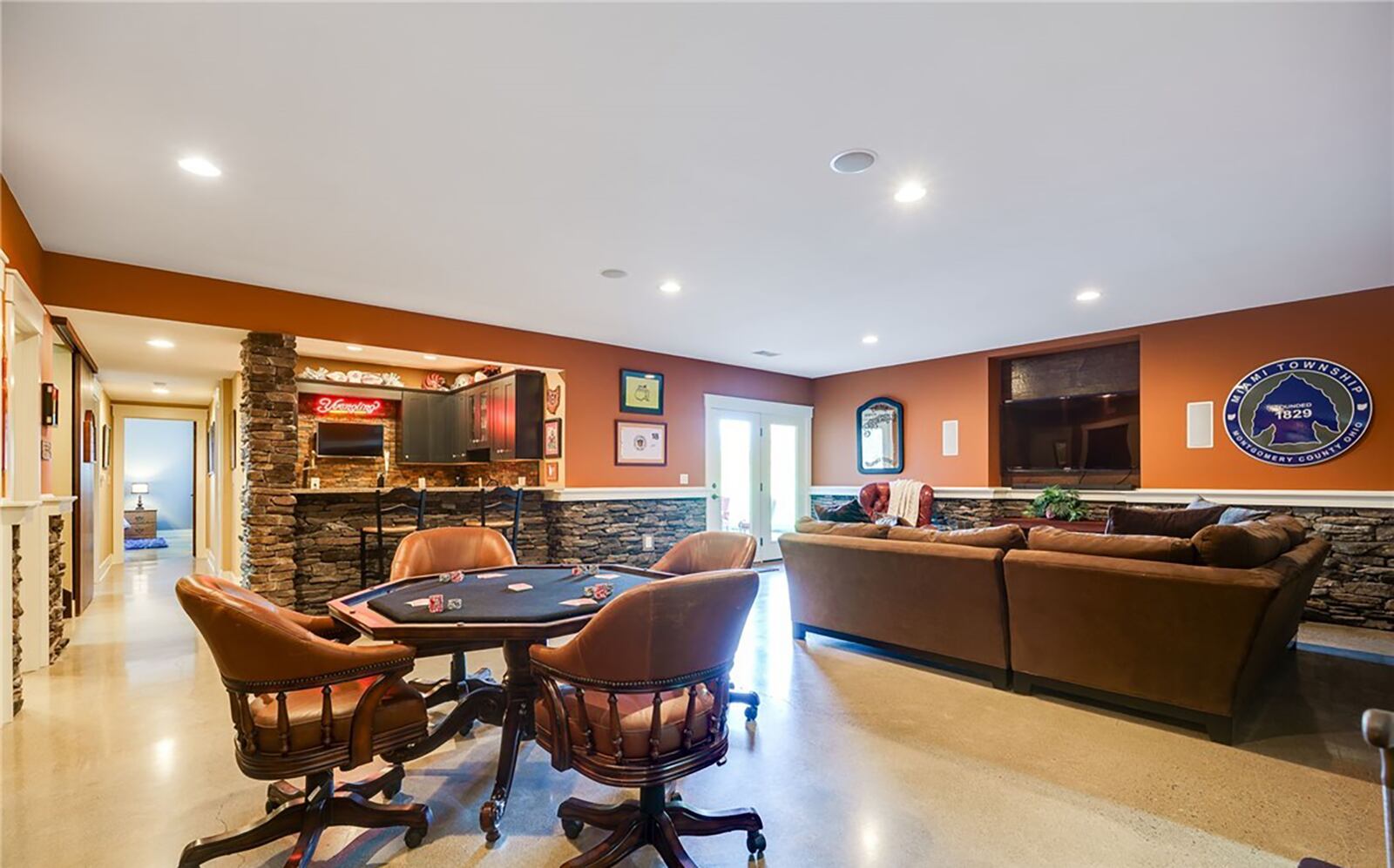 The finished walk out basement has a rec room, wet bar, exercise room and two bedrooms with daylight windows as well as one flex room. CONTRIBUTED