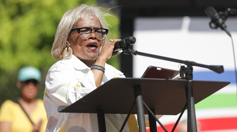 Springfield NAACP president Denise Williams speaks during "Love Thy Neighbor," on Saturday, Aug. 2, at City Hall Plaza in downtown Springfield. The event was organized by Springfield G92, a coalition of churches that says it is "committed to the safety and dignity of our Haitian neighbors and friends." Over a dozen people spoke, and two choirs performed. The organization said the goal of the event was to "project love, unity and support for our immigrant neighbors and community." BRYANT BILLING / STAFF