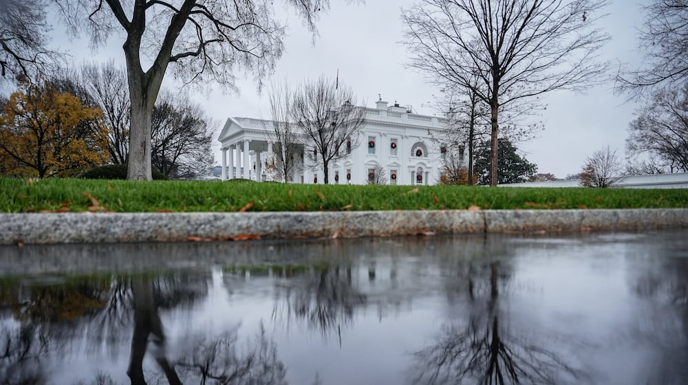 FILE - The White House is reflected in a puddle, Dec. 2, 2025, in Washington. (AP Photo/Julia Demaree Nikhinson, File)