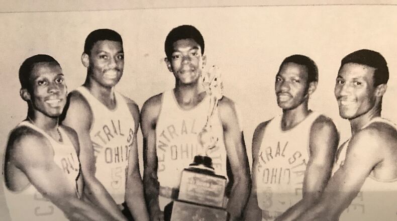 Central State’s starting five (left to right) Clarence Lane, Chris Buchanan, Roy Hinton, Graham Russell and Robert Moore with the NAIA championship trophy. CONTRIBUTED