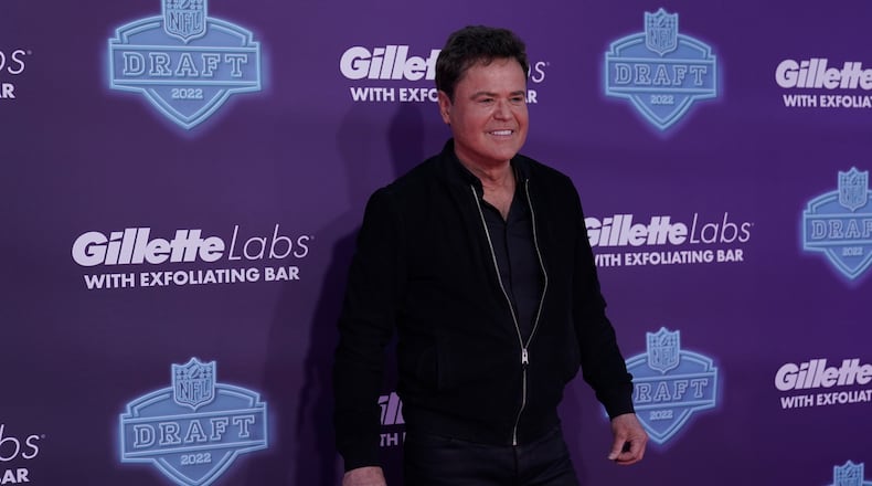 Singer Donny Osmond poses on the red carpet before the first round of the NFL football draft Thursday, April 28, 2022, in Las Vegas. He will perform July 26 at Kettering's Fraze Pavilion. (AP Photo/Jae C. Hong )