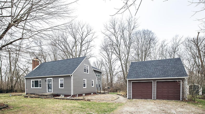 The 3-bedroom, Cape Cod-style home offers about 2,070 sq. ft. of living space and includes a new family/dining room addition and remodeled kitchen. The 1.25-acre lot with wooded views includes a detached, 2-car garage. CONTRIBUTED PHOTO
