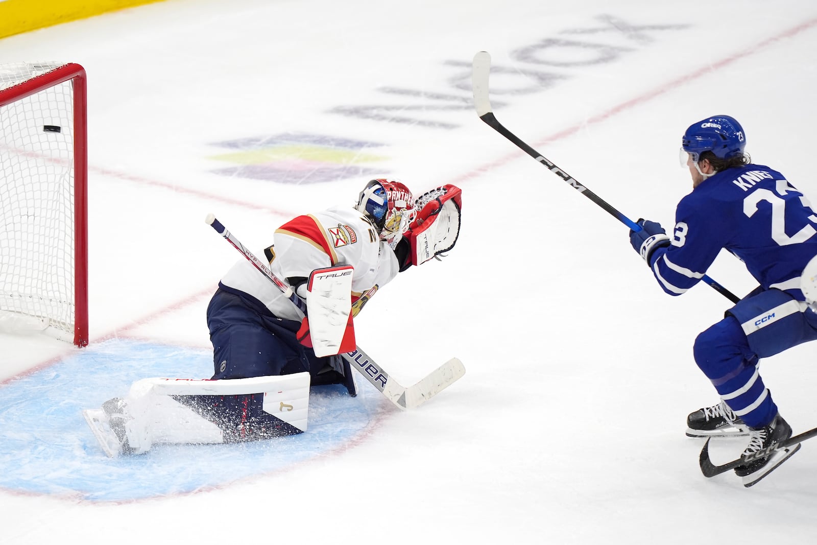Toronto Maple Leafs forward Matthew Knies (23) scores against Florida Panthers goaltender Sergei Bobrovsky, left, during during the third period of Game 1 in an NHL hockey second-round playoff series in Toronto, Monday, May 5, 2025. (Frank Gunn/The Canadian Press via AP)