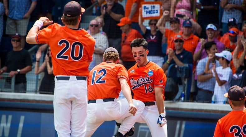 Virginia's Anthony Stephan (16) celebrates after scoring against Duke during an NCAA college baseball tournament super regional game on Sunday, June 11, 2023, in Charlottesville, Va. (AP Photo/John C. Clark)