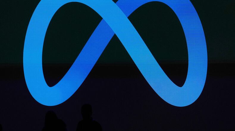 FILE -A Meta logo is shown on a video screen at LlamaCon 2025, an AI developer conference, in Menlo Park, Calif., April 29, 2025. (AP Photo/Jeff Chiu, File)