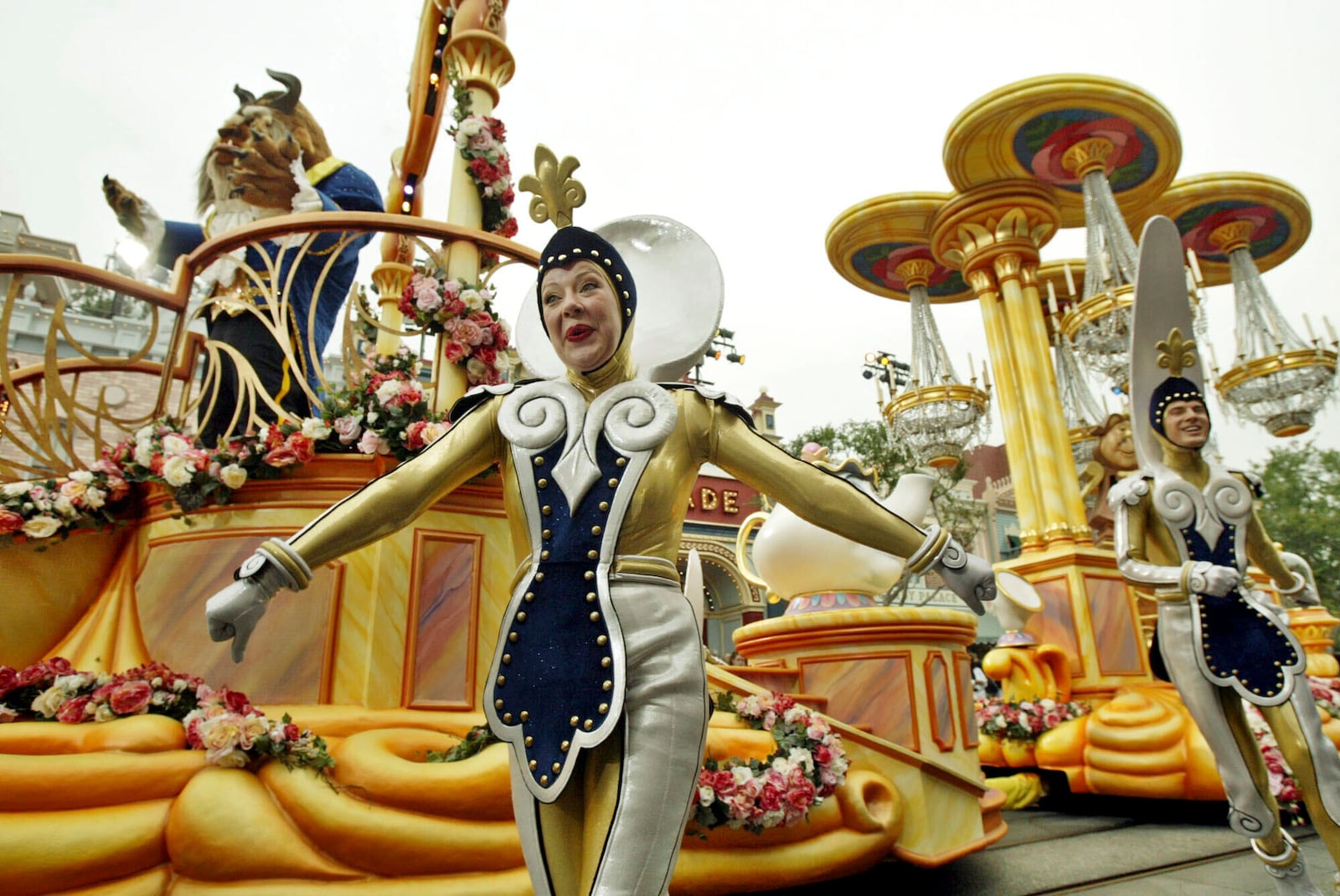 FILE - The "Beauty and the Beast" float, along with supporting characters, entertains visitors to Disneyland during "Walt Disney's Parade of Dreams" in Anaheim, Calif., May 4, 2005. (AP Photo/Ric Francis, File)