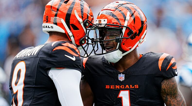 Cincinnati Bengals wide receiver Ja'Marr Chase celebrates after scoring with quarterback Joe Burrow against the Carolina Panthers during the first half of an NFL football game, Sunday, Sept. 29, 2024, in Charlotte, N.C. (AP Photo/Rusty Jones)