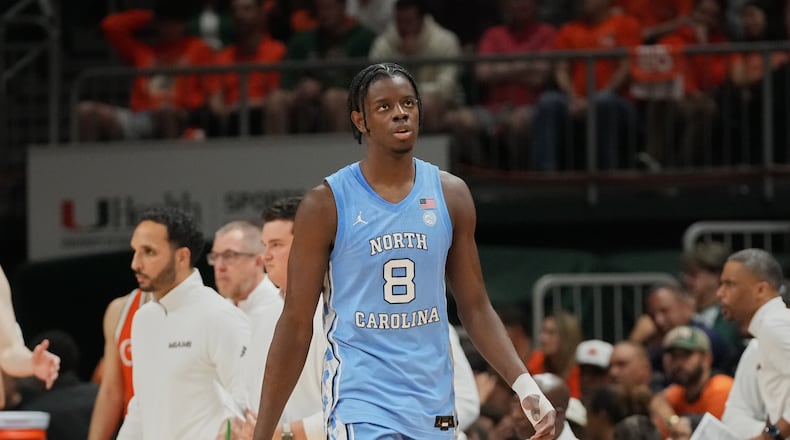 FILE - North Carolina forward Caleb Wilson (8), his left hand in a bandage, walks back to the bench during the second half of an NCAA college basketball game against Miami, Tuesday, Feb. 10, 2026, in Coral Gables, Fla. (AP Photo/Marta Lavandier, File)