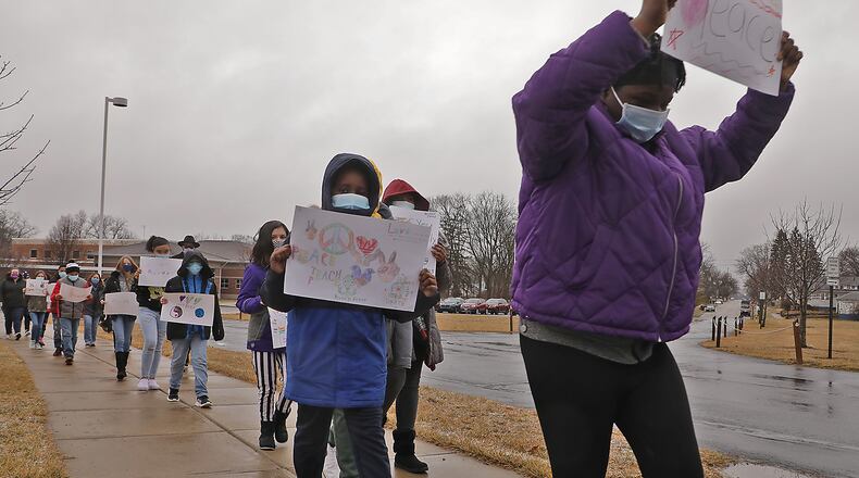 Students from the sixth grade at Fulton Elementary held a peace march Friday. The students at the school have been studying Martin Luther King all week and in light of the violent protests at the Capital in Washington last week, the sixth grade wanted to demonstrate how to peacefully protest. BILL LACKEY/STAFF