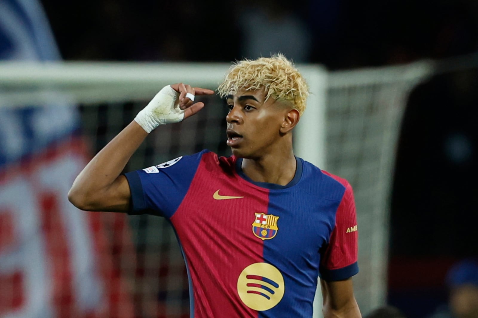 Barcelona's Lamine Yamal celebrates after scoring his side's opening goal during the Champions League semifinal first leg soccer match between Barcelona and Inter Milan at the Lluis Companys Olympic Stadium in Barcelona, Spain, Wednesday, April 30, 2025. (AP Photo/Joan Monfort)