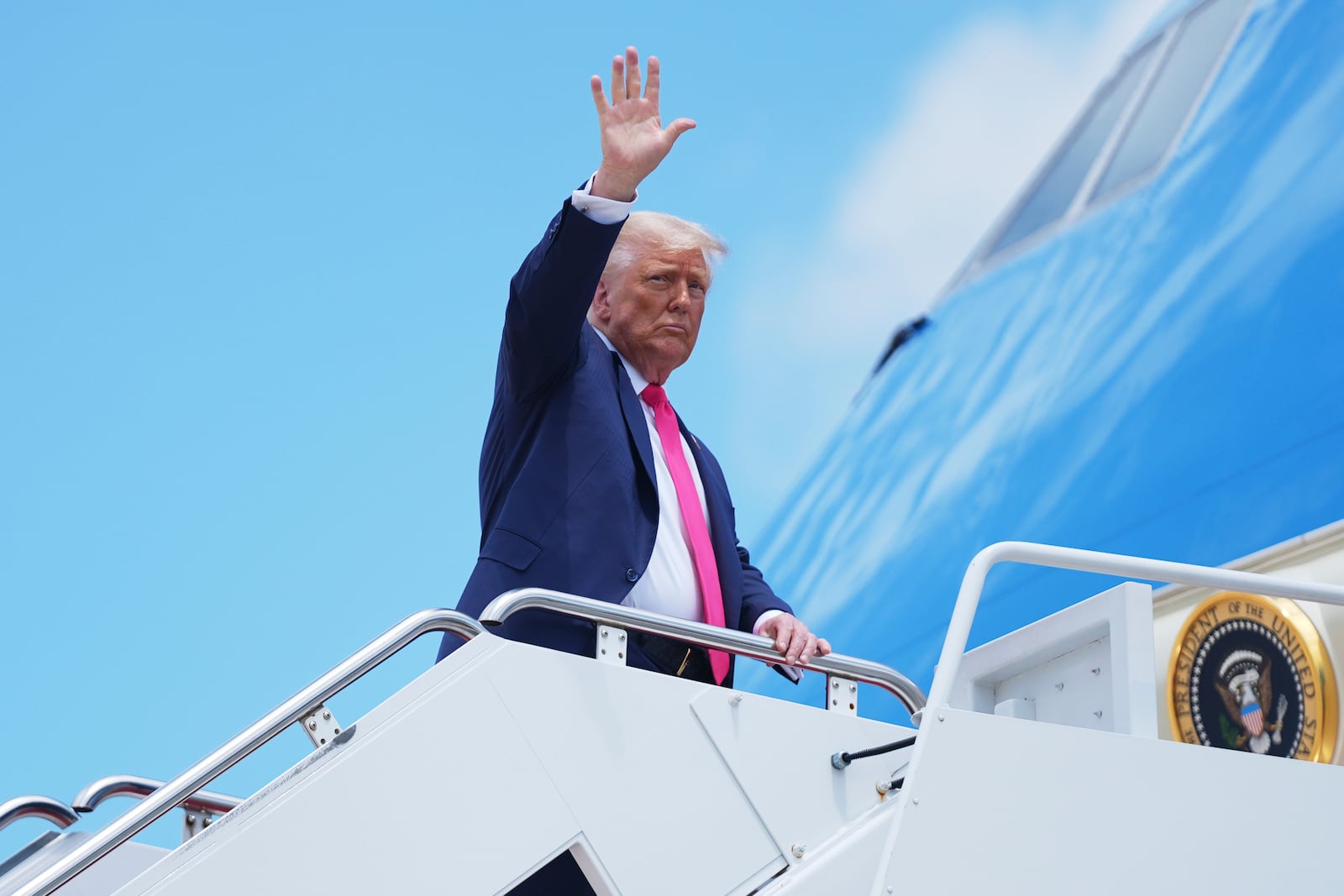 President Donald Trump gestures as he boards Air Force One, Tuesday, July 15, 2025, in Joint Base Andrews, Md. (AP Photo/Evan Vucci)