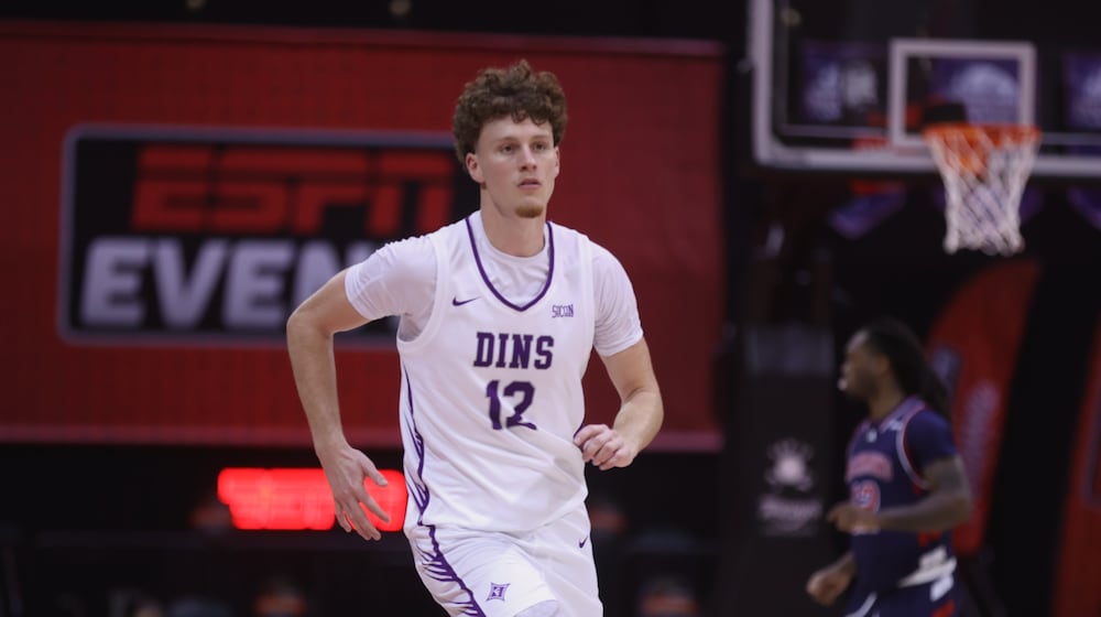 Centerville graduate Tom House, a senior at Furman, plays against Richmond in the first round of the ESPN Events Invitational on Thursday, Nov. 27, 2025, at the State Farm Field House in Kissimmee, Fla. David Jablonski/Staff