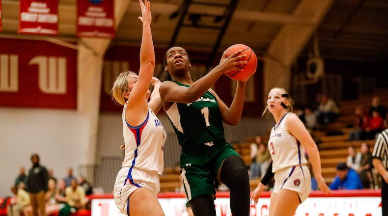 Cutline 1: Catholic Central High School senior Jordyn Smoot drives to the basket during their game against Northwestern earlier this season at the Clark County Basketball Showcase at Pam Evans Smith Arena in Springfield. Michael Cooper/CONTRIBUTED