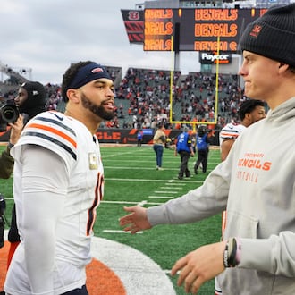 Cincinnati Bengals quarterback Joe Burrow (9), right, greets Chicago Bears quarterback Caleb Williams (18) after an NFL football game, Sunday, Nov. 2, 2025, in Cincinnati. (AP Photo/Jeff Dean)