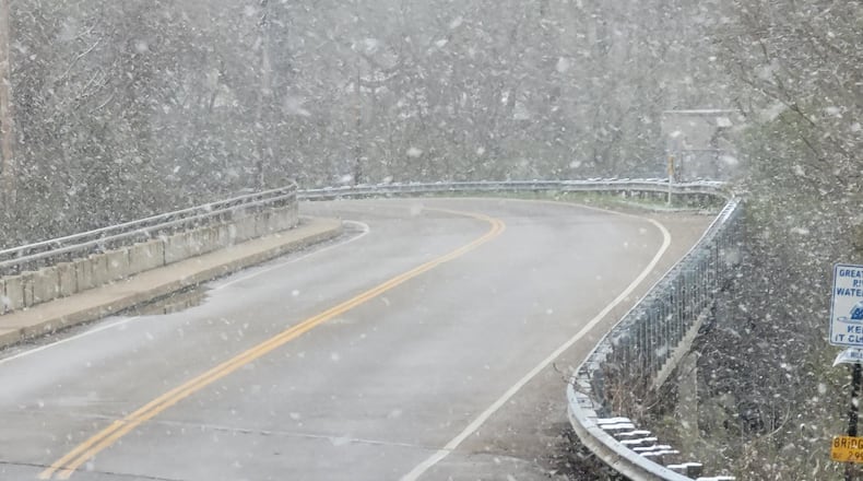 Snow was falling in Butler County on Thursday, April 1, 2021. NICK GRAHAM / STAFF