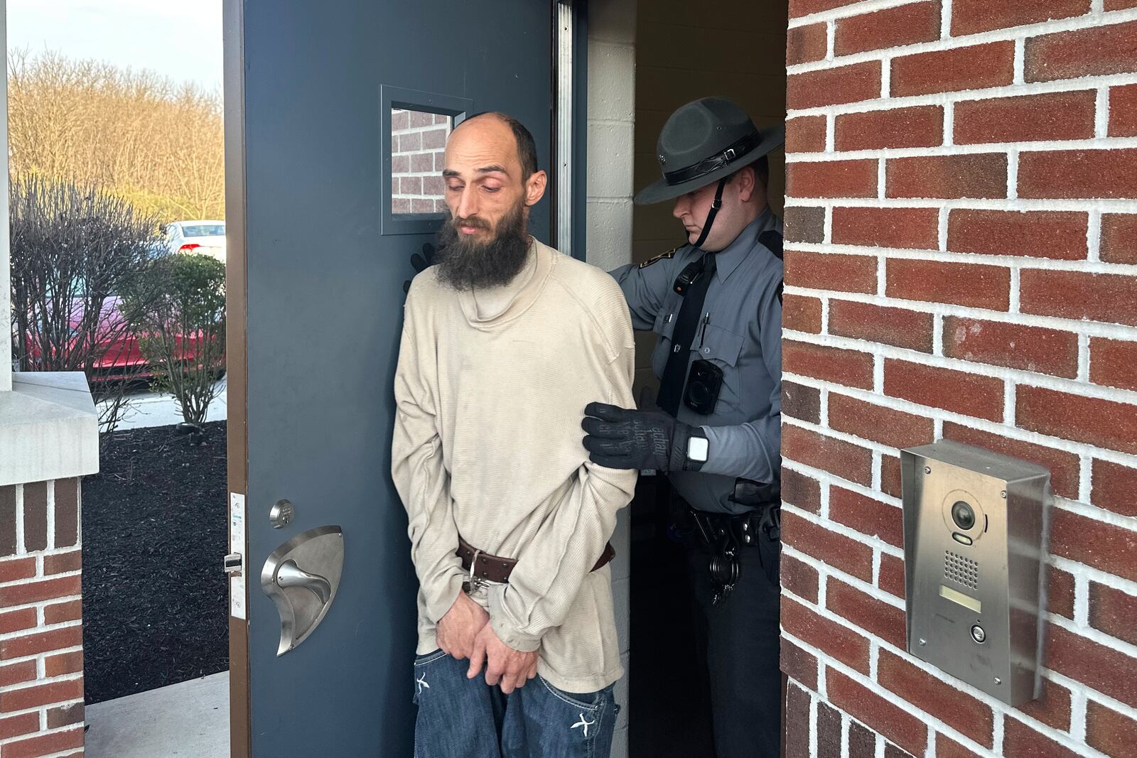 Cody Balmer is taken from a courtroom Monday, April 14, 2025, in Harrisburg, Pa., after being denied bail for charges he broke into the governor's residence and started a fire that did extensive damage. (AP Photo/Mark Scolforo)