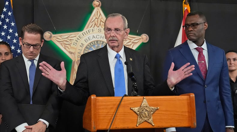 FILE - Palm Beach County Sherriff Ric Bradshaw, center, speaks during a news conference by law enforcement officials, Monday, Sept. 16, 2024, at the Palm Beach County Sheriff's Office in West Palm Beach, Fla.. (AP Photo/Wilfredo Lee, File)