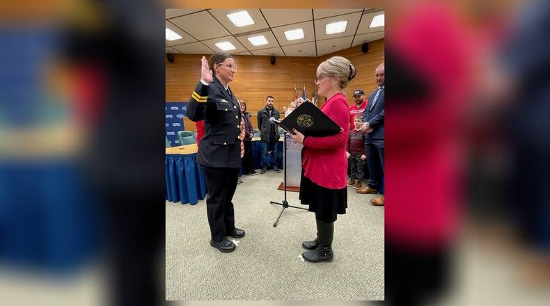 Allison Elliott takes the oath of office as the new Springfield chief of police on Tuesday, Dec 20, 2022, administered by Jill Pierce, city clerk. CONTRIBUTED