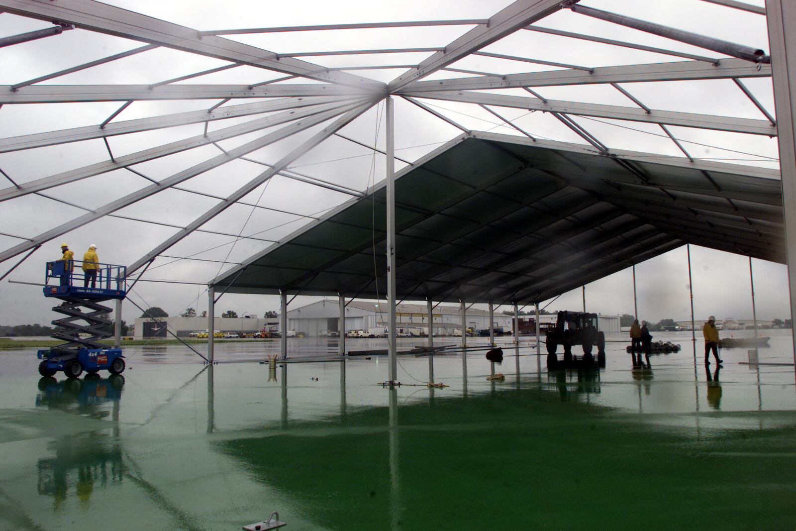 Workers with Glawe Awnings and Tents install a 20,000 sq. ft. pavilion tent that housed the Birth of Aviation Centerpiece Exhibit at a previous Vectren Dayton Air Show.