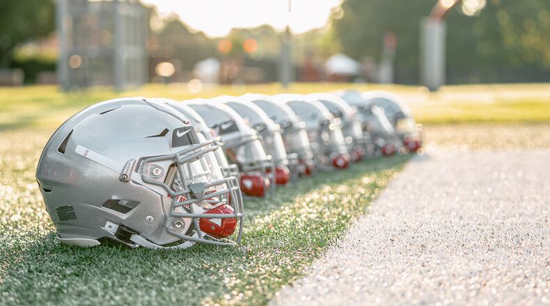 Ohio State football helmets set up at practice