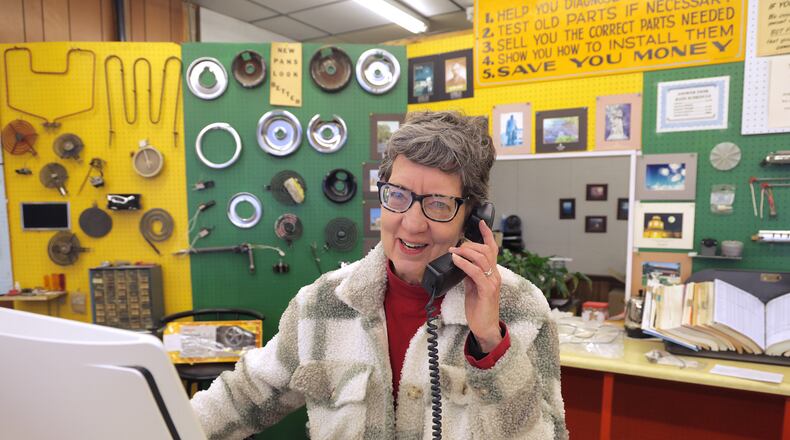 Bonnie Proper, the owner of Mr. Handy Appliance Parts Center, answers a call from a cutomer Thursday, Feb. 13, 2024. Bonnie announced Wednesday night on social media that the store will close after 45 years. BILL LACKEY/STAFF