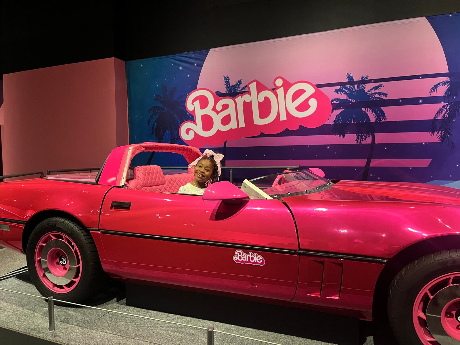 Lyric Goodwin, 7, of Cincinnati takes a spin in Barbie's car.
Credit: Meredith Moss