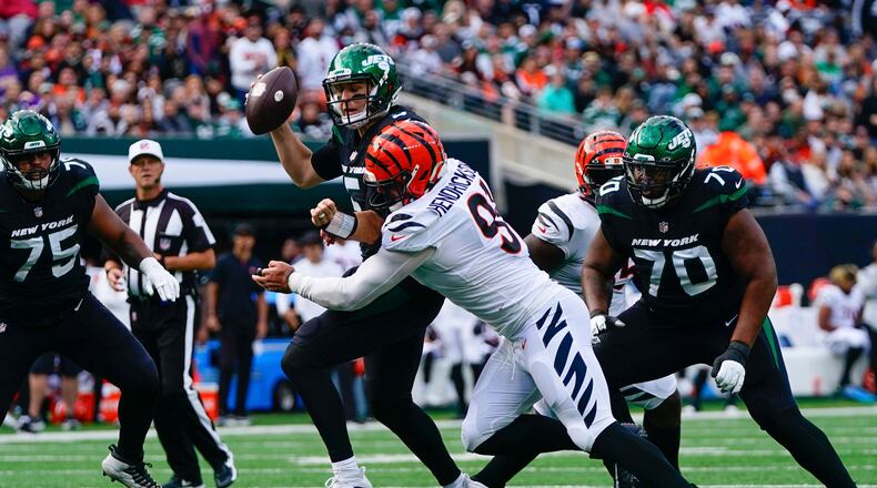Cincinnati Bengals' Trey Hendrickson, second from right, tackles New York Jets quarterback Mike White during the second half of an NFL football game, Sunday, Oct. 31, 2021, in East Rutherford, N.J. (AP Photo/Frank Franklin II)